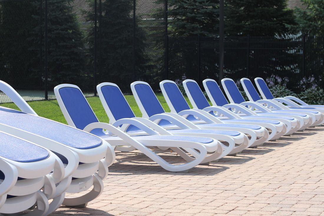 Outdoor lounge chairs before shrink wrapping