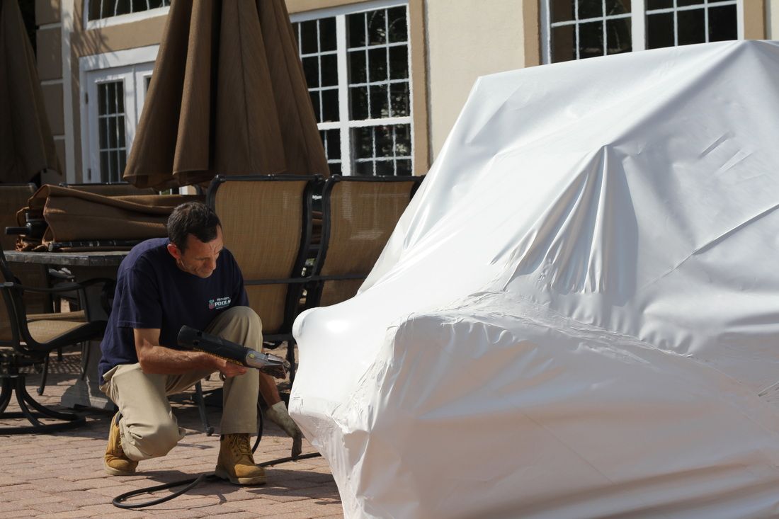 Suffolk County Shrink Wrap crew installing outdoor furniture shrink wrap